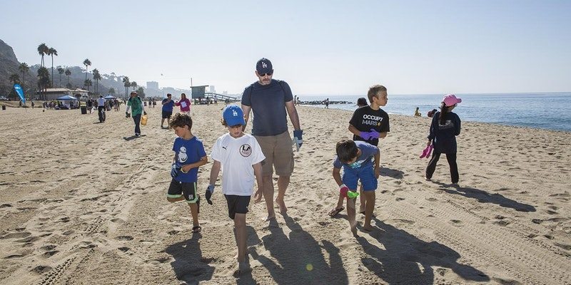 volunteers cleaning the beach on Earth Day