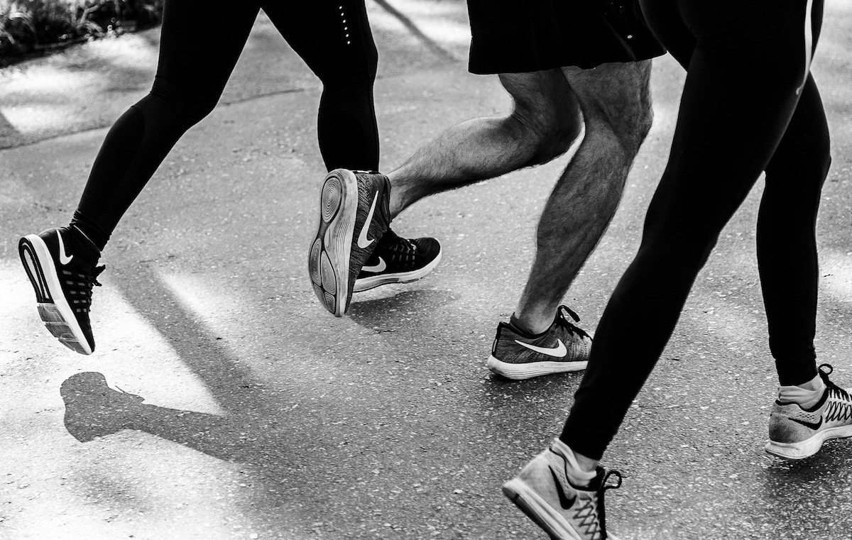 close up of runners legs in a black and white photo