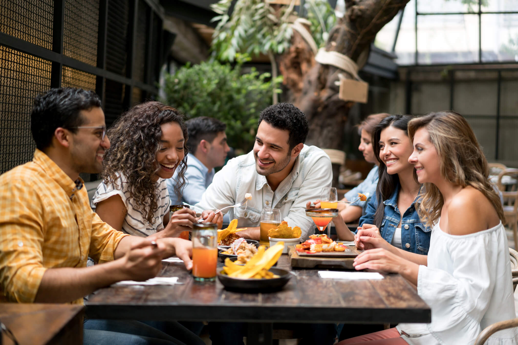 friends eating and drinking outdoors